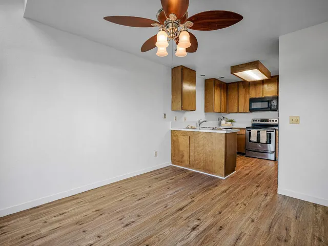 a view of kitchen with wooden floor