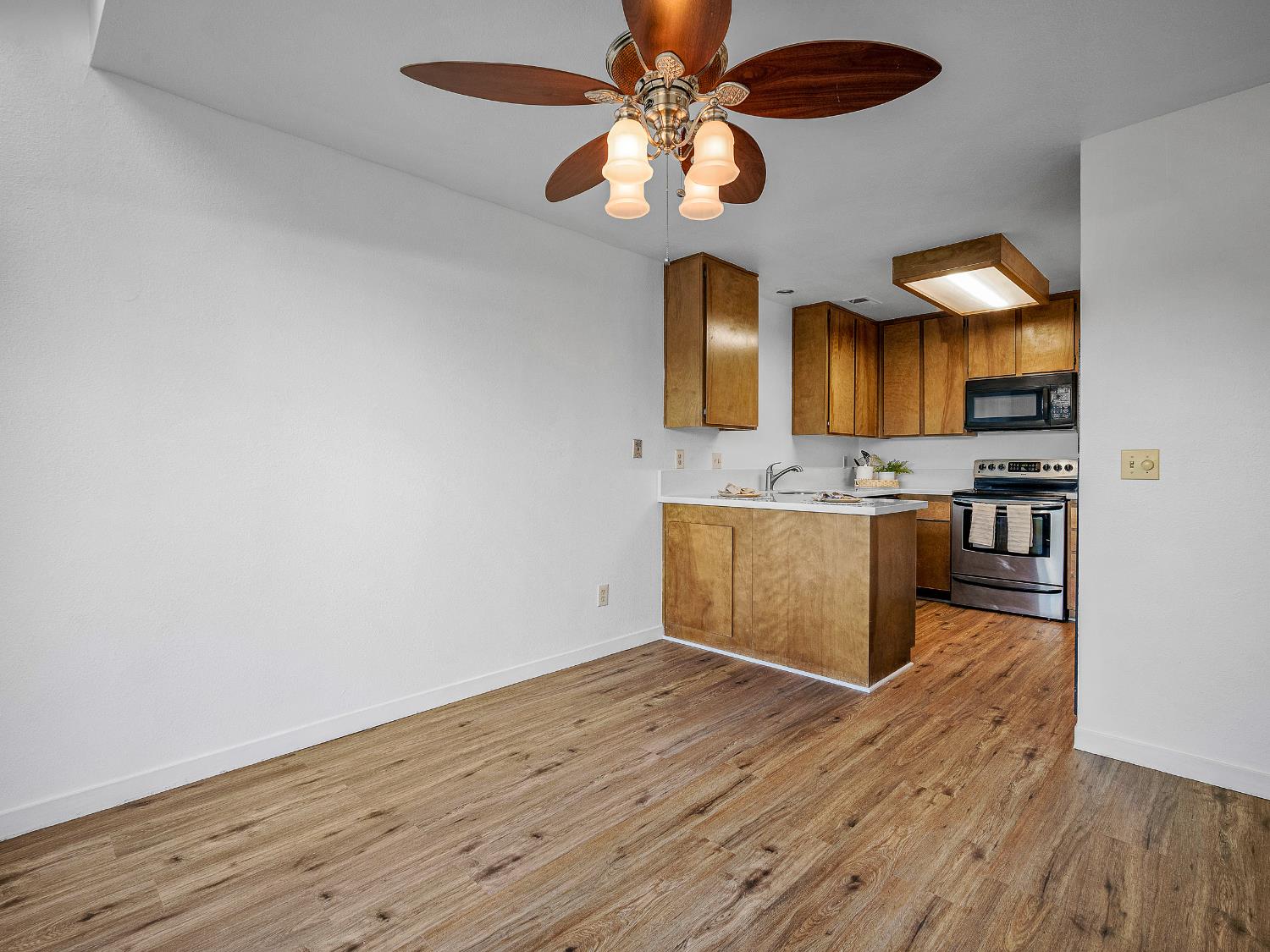 1519 Hood Road, Unit F Sacramento, CA 95825 - Photo 4 of 28 a view of kitchen with wooden floor
