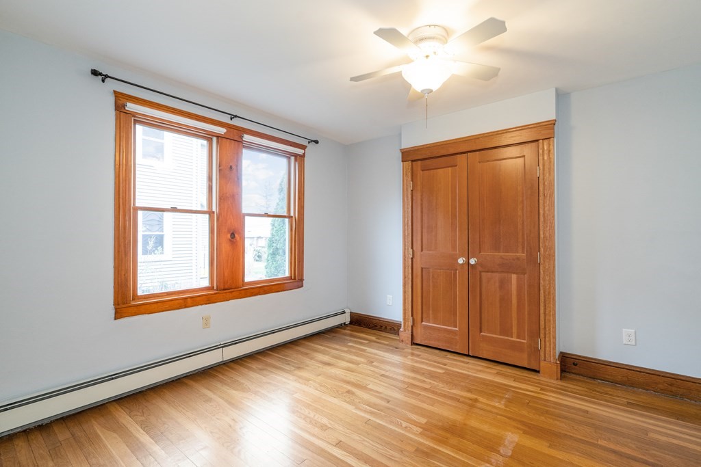 13-15 Fordham Road Newton, MA 02465 - Photo 11 of 30 a view of an empty room with window and a chandelier fan