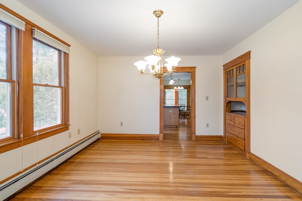 13-15 Fordham Road Newton, MA 02465 - Photo 15 of 30 a view of an empty room with wooden floor and a window