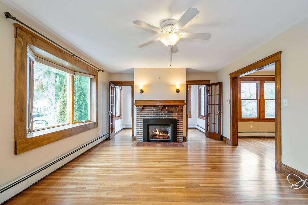 13-15 Fordham Road Newton, MA 02465 - Photo 2 of 30 a living room with fireplace furniture and a large window