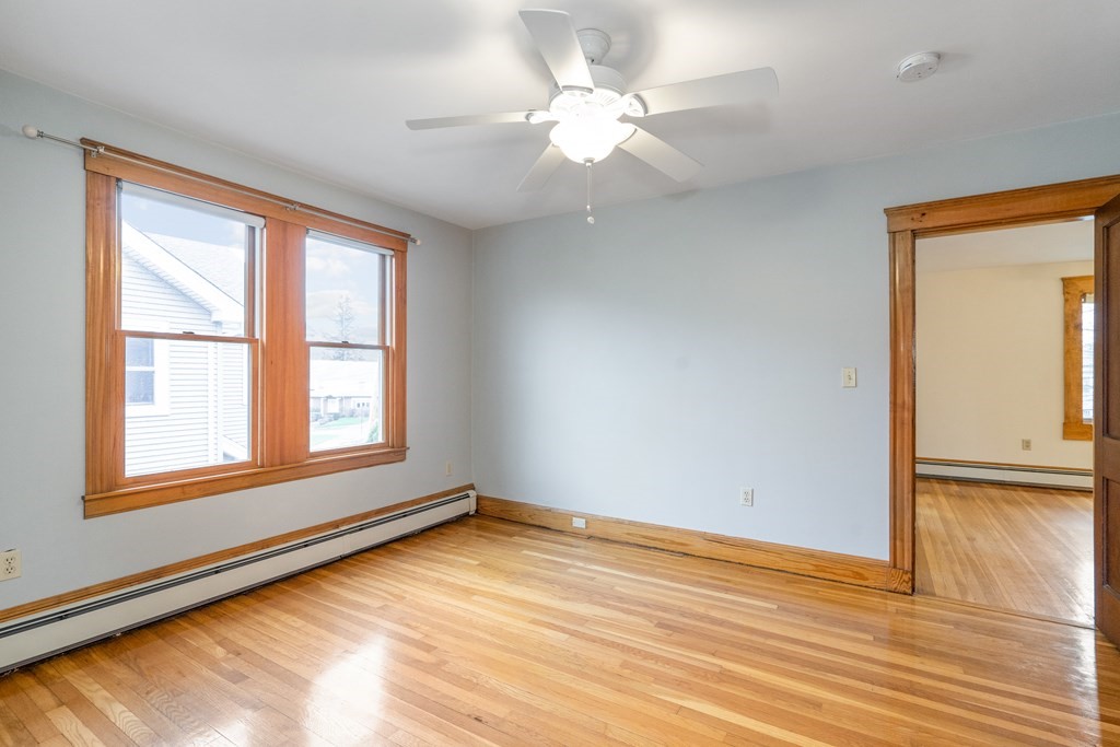 13-15 Fordham Road Newton, MA 02465 - Photo 21 of 30 wooden floor in an empty room with a window