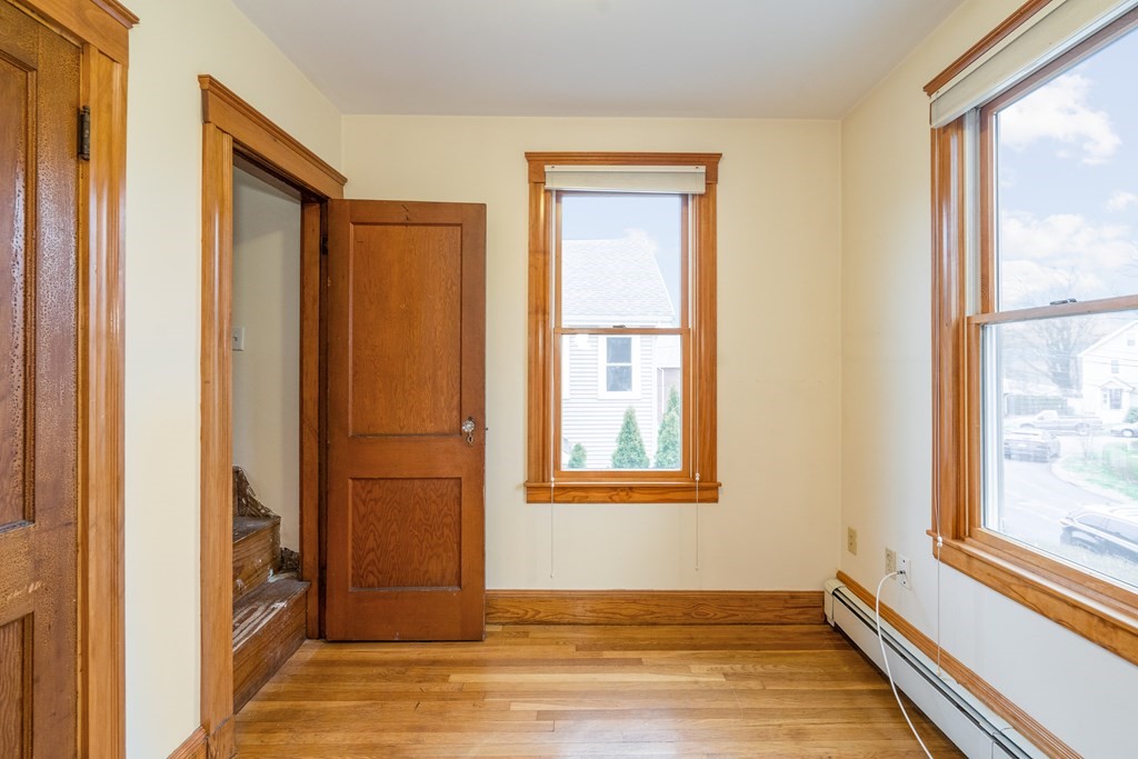 13-15 Fordham Road Newton, MA 02465 - Photo 22 of 30 an empty room with wooden floor and windows