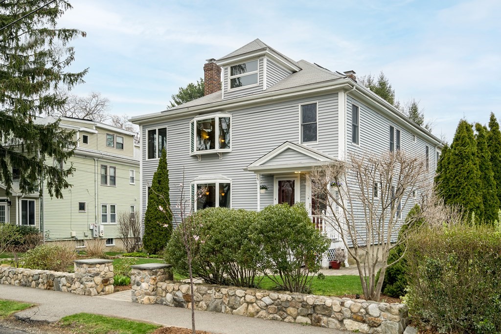 13-15 Fordham Road Newton, MA 02465 - Photo 23 of 30 a view of a white house with large windows and plants