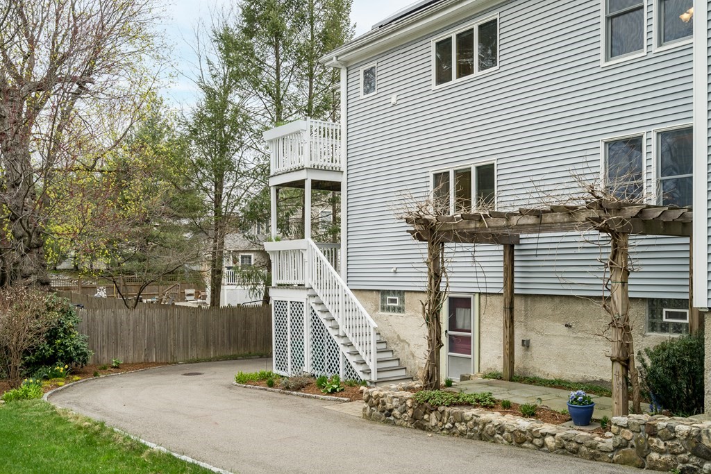 13-15 Fordham Road Newton, MA 02465 - Photo 24 of 30 a front view of a house with a yard