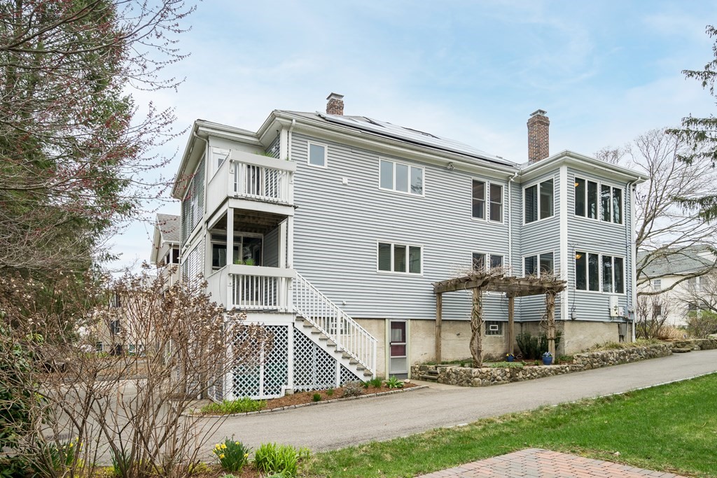 13-15 Fordham Road Newton, MA 02465 - Photo 25 of 30 a front view of a house with a yard