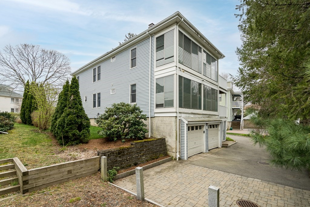 13-15 Fordham Road Newton, MA 02465 - Photo 26 of 30 a front view of a house with a garden