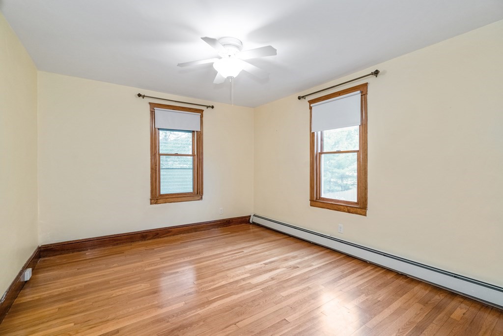 13-15 Fordham Road Newton, MA 02465 - Photo 9 of 30 wooden floor in an empty room with a window