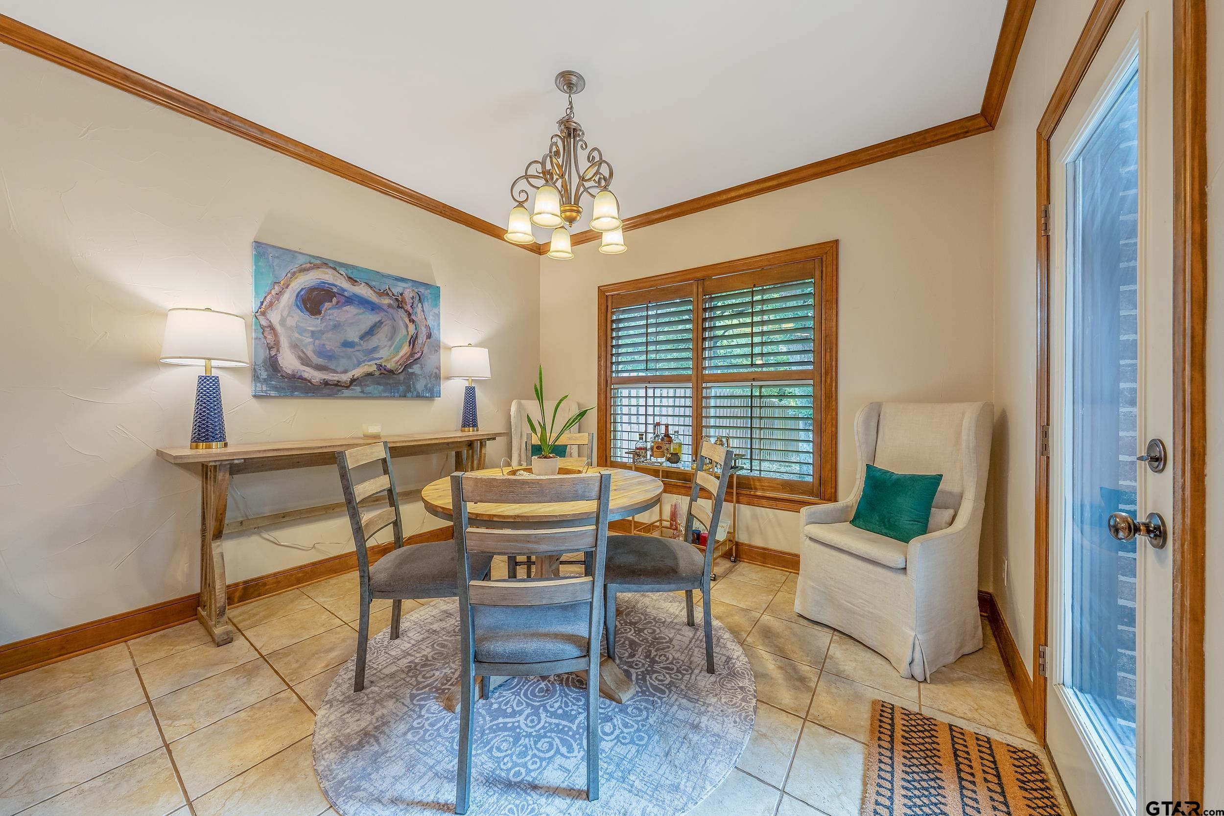 7216 Princedale Tyler, TX 75703 - Photo 12 of 27 a living room with furniture and a chandelier