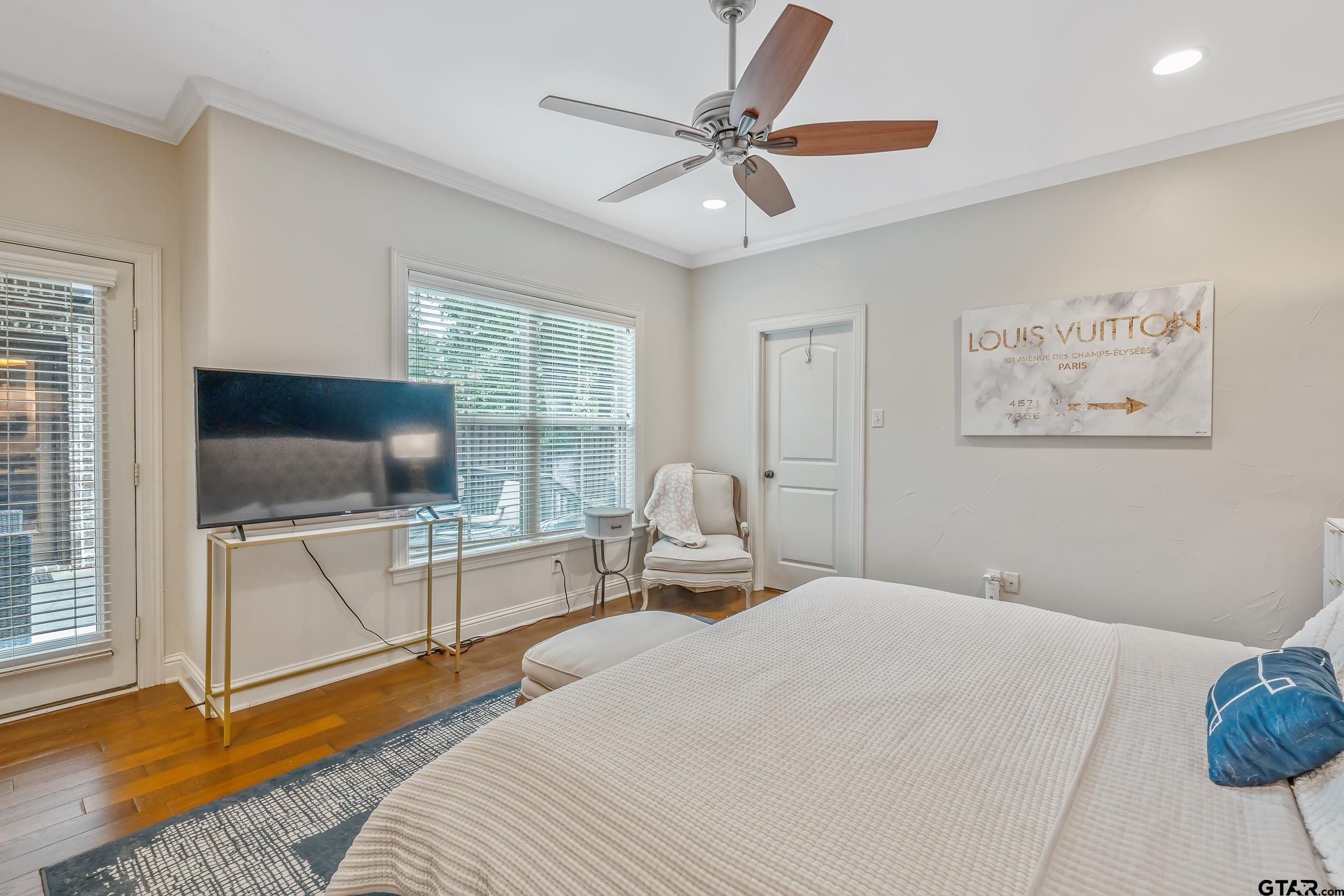 7216 Princedale Tyler, TX 75703 - Photo 16 of 27 a bedroom with a bed and a flat screen tv