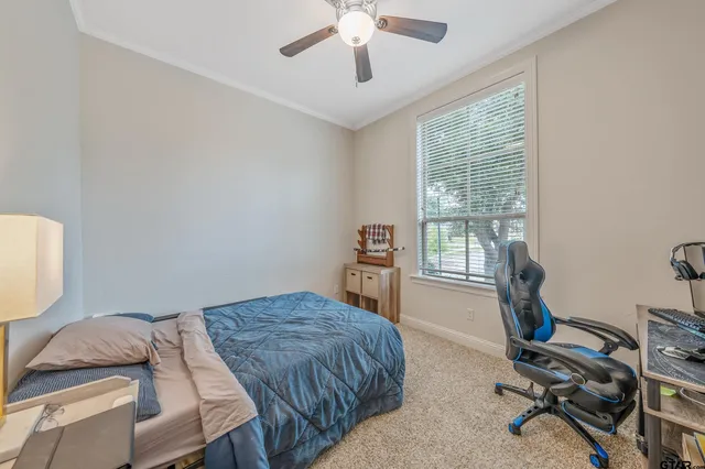 a bedroom with bed and window