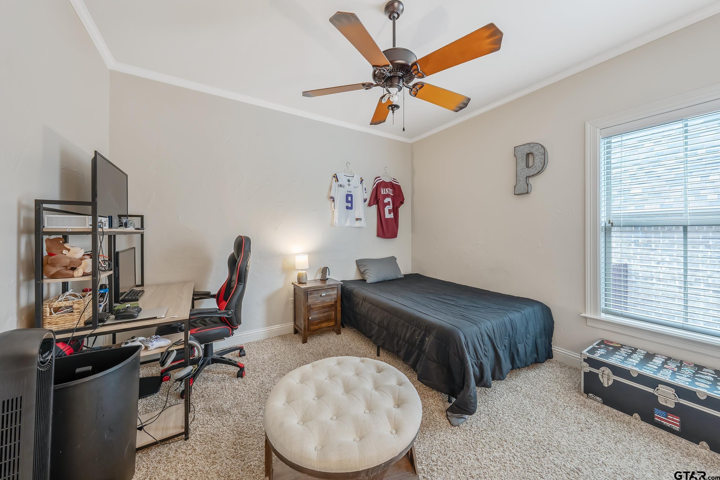 7216 Princedale Tyler, TX 75703 - Photo 22 of 27 a bedroom with bed and a large window