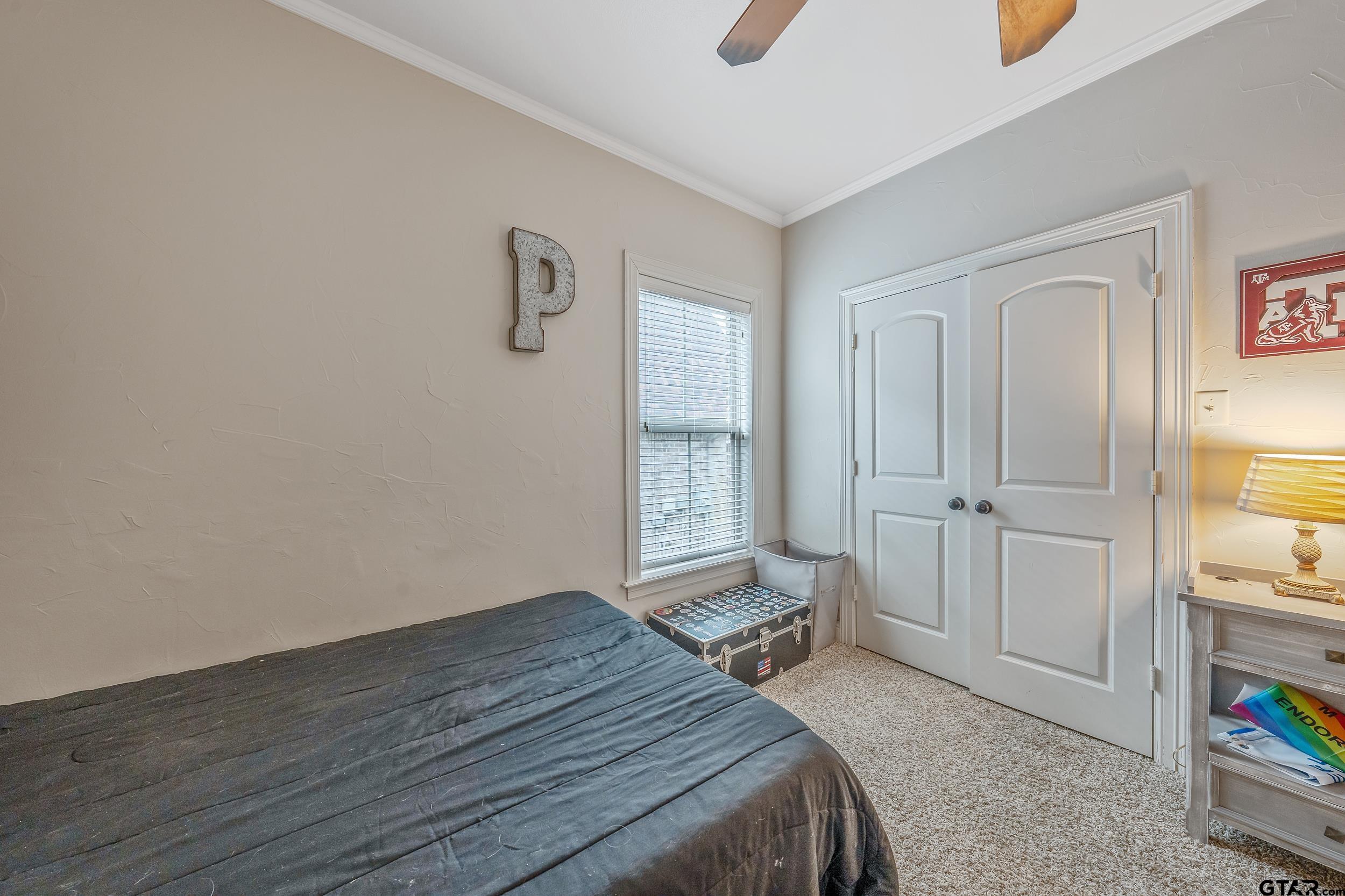 7216 Princedale Tyler, TX 75703 - Photo 23 of 27 a bedroom with a bed and a window