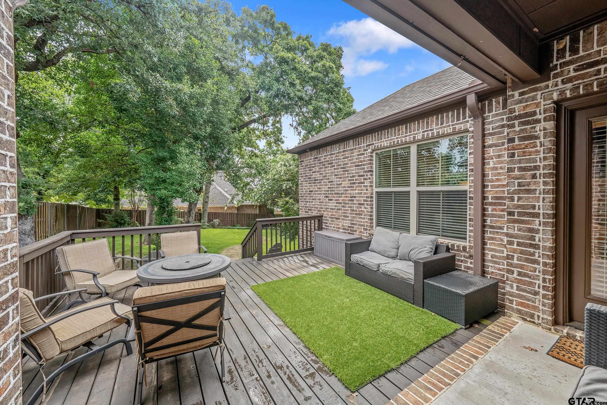 7216 Princedale Tyler, TX 75703 - Photo 24 of 27 a view of a patio with couches and a table and chairs with garden view