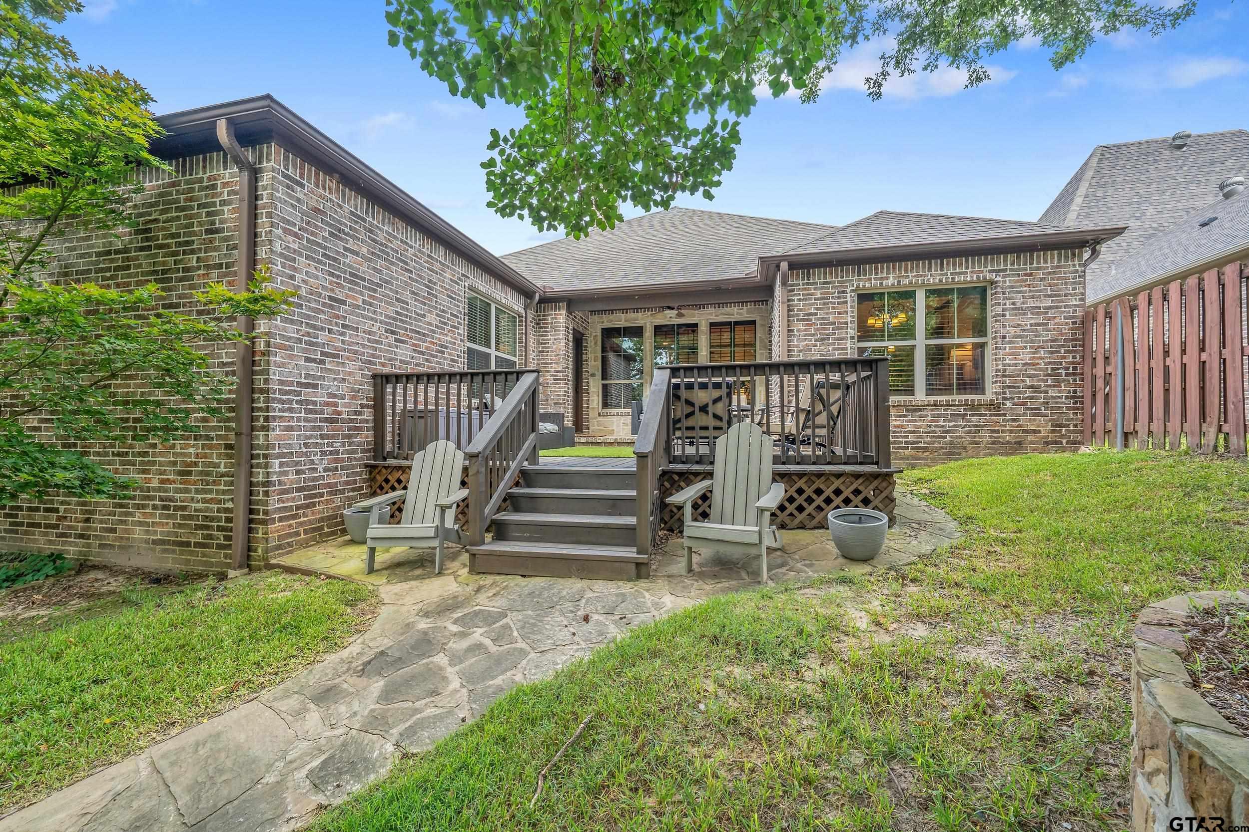 7216 Princedale Tyler, TX 75703 - Photo 25 of 27 a view of a house with backyard and a garden