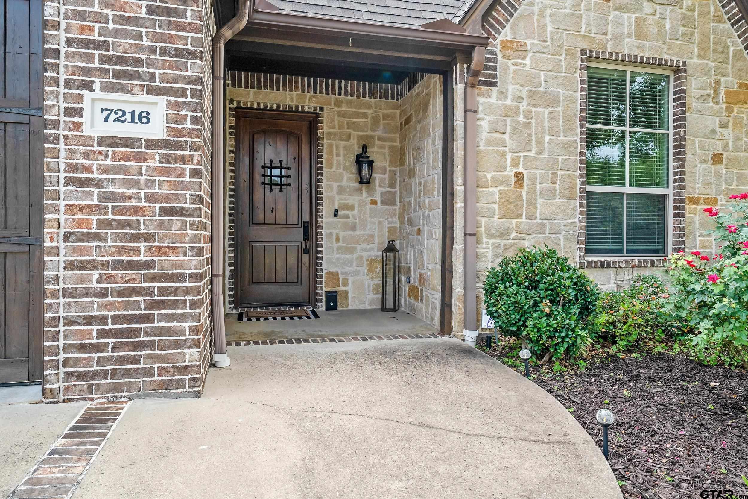 7216 Princedale Tyler, TX 75703 - Photo 4 of 27 a front view of a building with potted plants