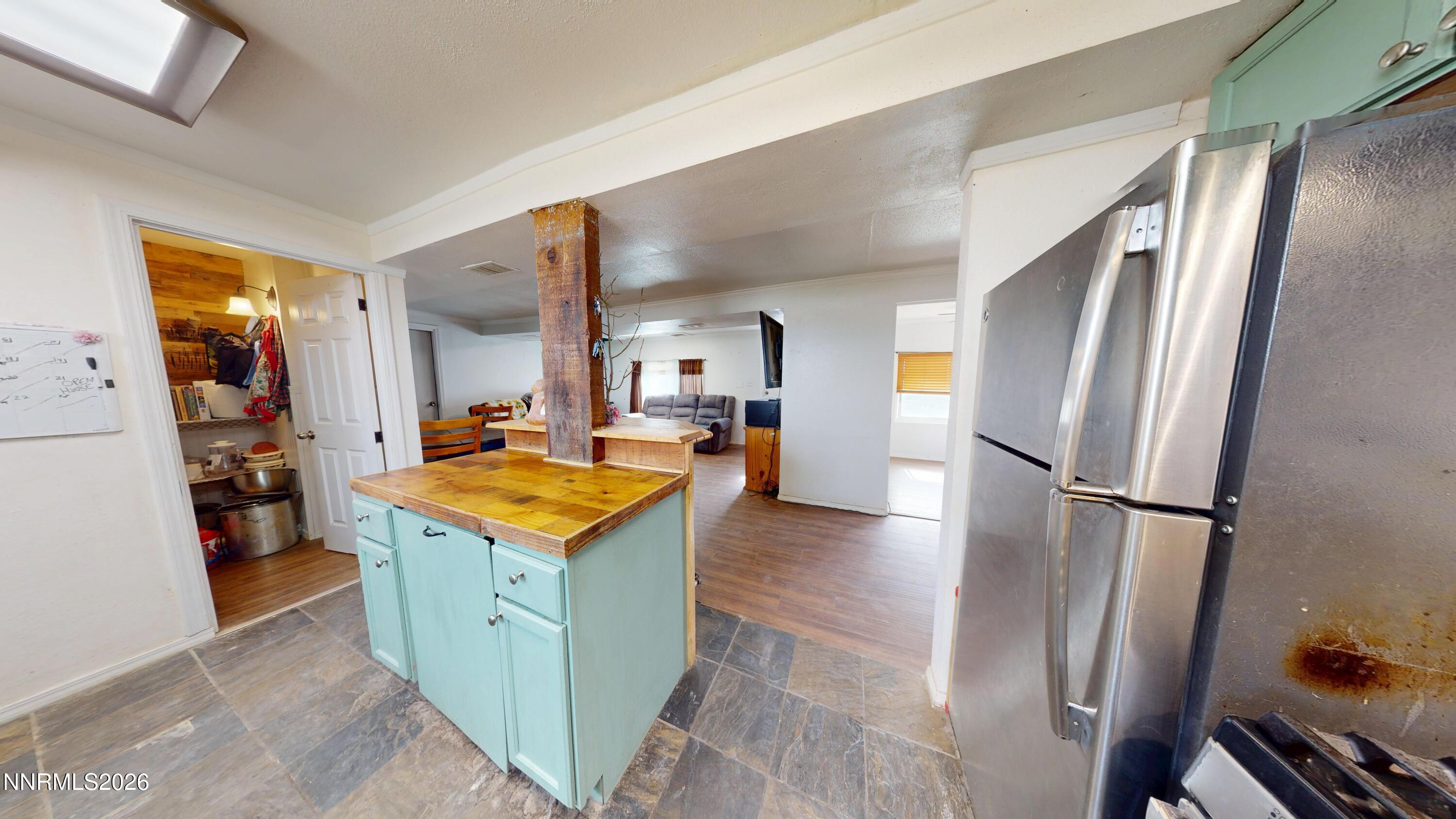 5355 Godchaux Road Winnemucca, NV 89445 - Photo 12 of 37 a kitchen with stainless steel appliances granite countertop a refrigerator and a stove
