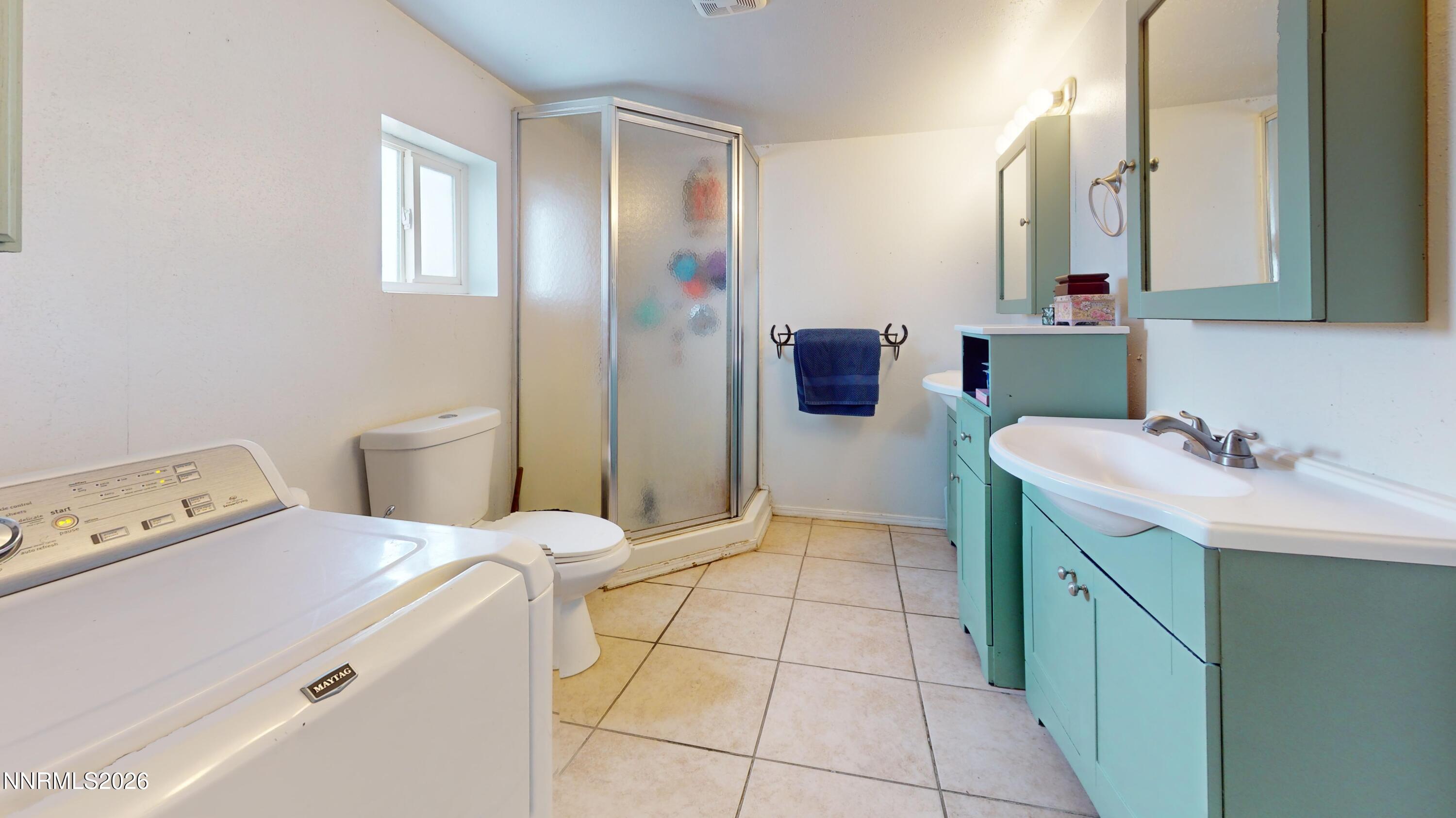 5355 Godchaux Road Winnemucca, NV 89445 - Photo 17 of 37 a bathroom with a sink toilet and mirror