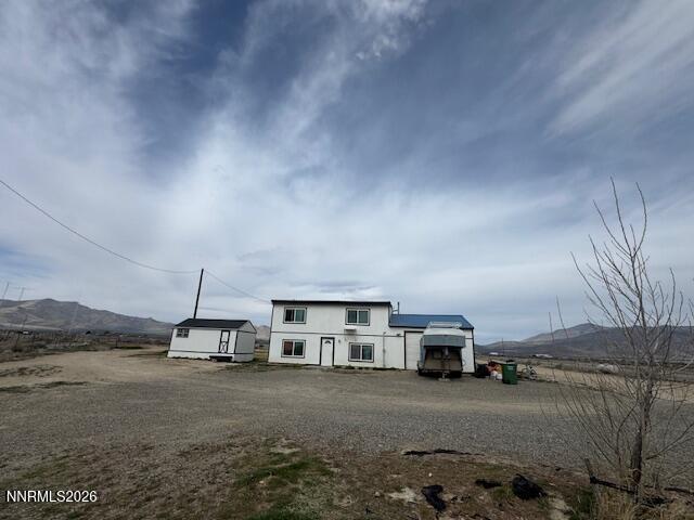5355 Godchaux Road Winnemucca, NV 89445 - Photo 2 of 37 a view of a house with a yard