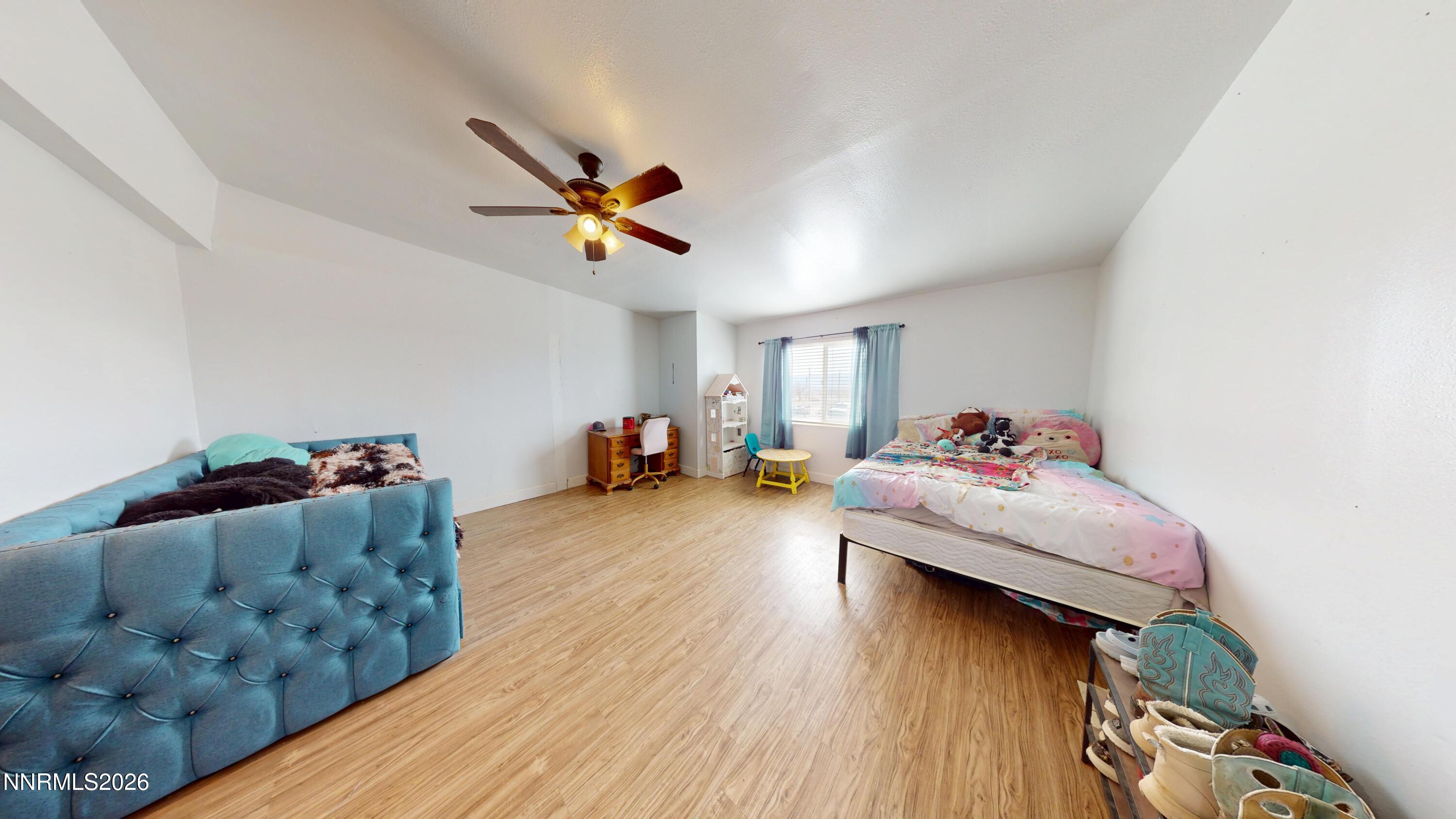 5355 Godchaux Road Winnemucca, NV 89445 - Photo 21 of 37 a living room with furniture and a wooden floor