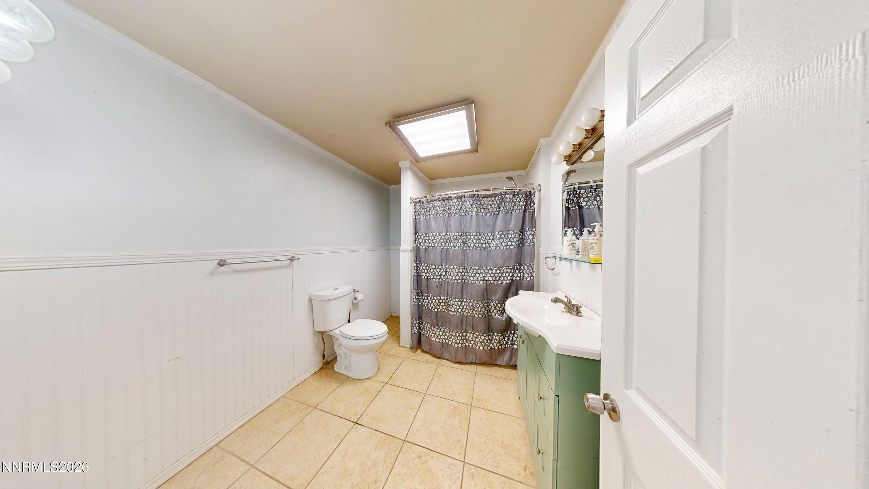 5355 Godchaux Road Winnemucca, NV 89445 - Photo 24 of 37 a bathroom with a sink mirror toilet and shower