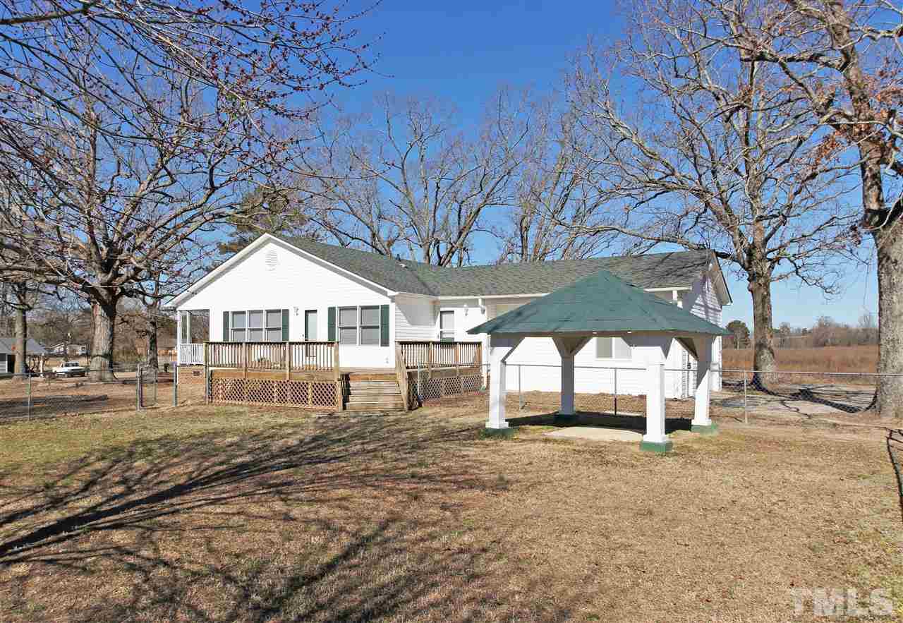 10105 Jordan Road Raleigh, NC 27603 - Photo 22 of 25 a front view of a house with a yard