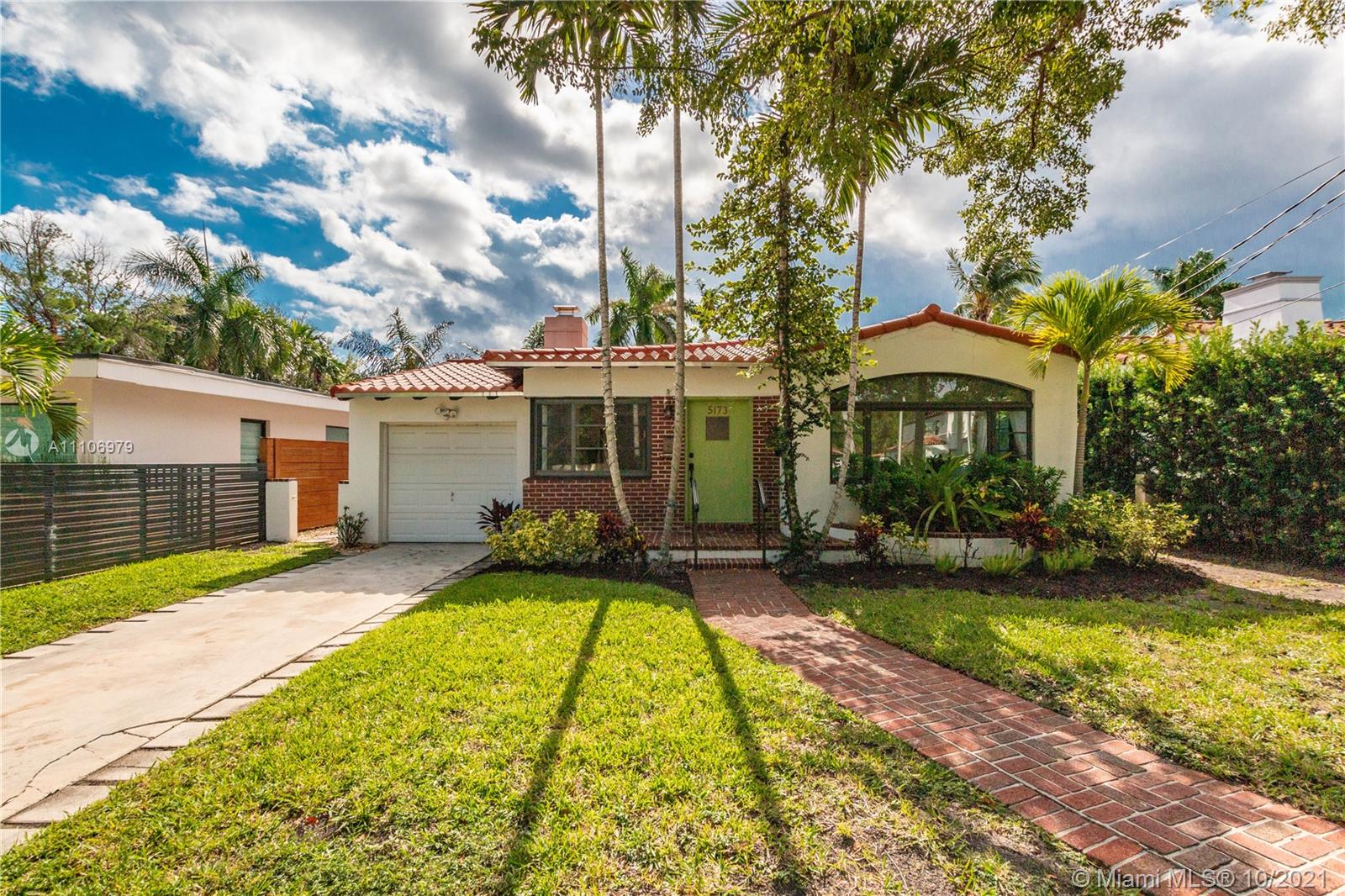 5173 Alton Road Miami Beach, FL 33140 - Photo 2 of 31 a view of a house with swimming pool and sitting area