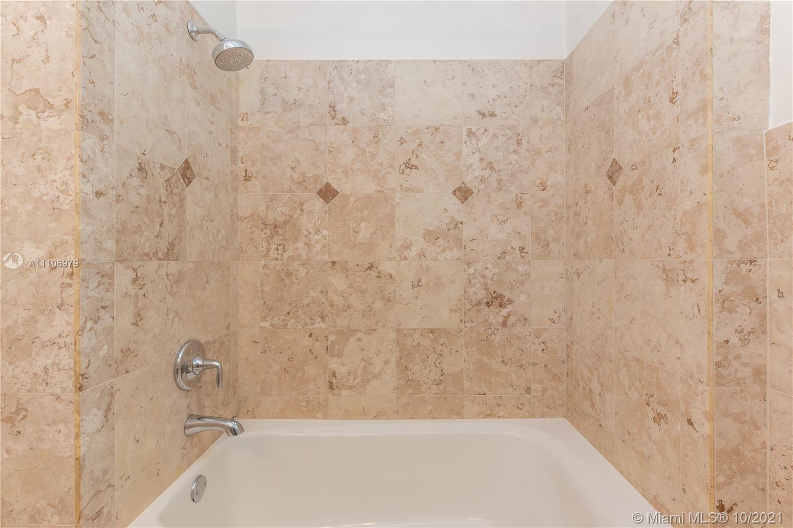 5173 Alton Road Miami Beach, FL 33140 - Photo 15 of 31 a bathroom with a bathtub