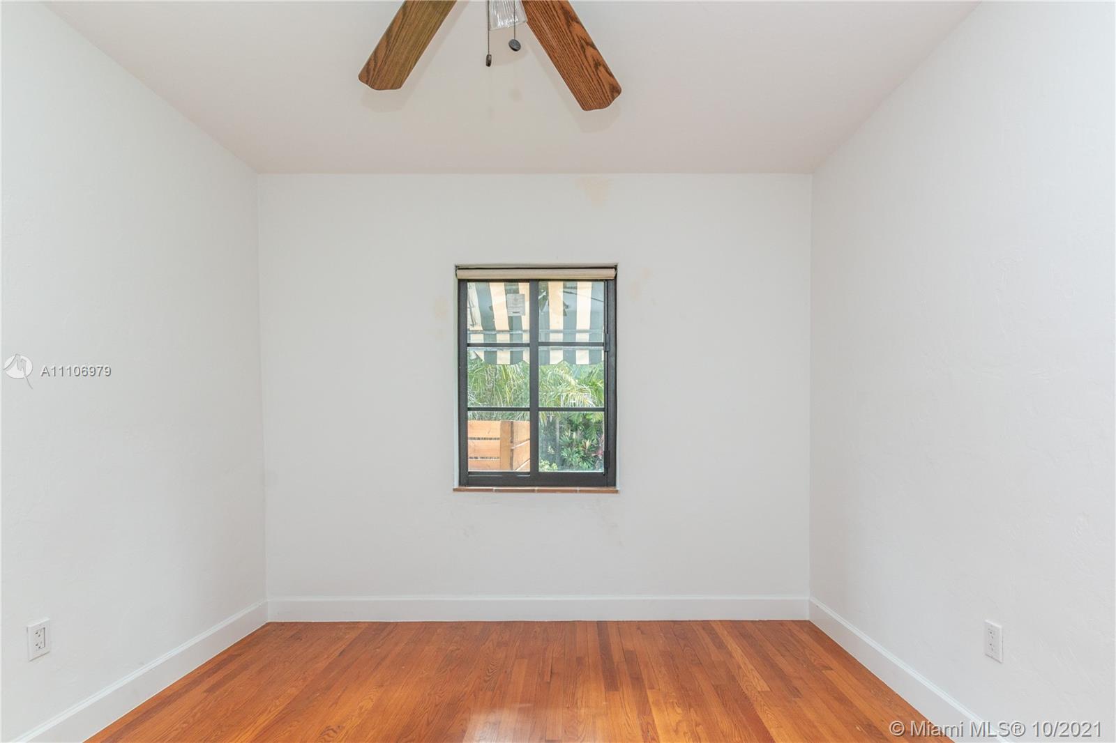 5173 Alton Road Miami Beach, FL 33140 - Photo 16 of 31 an empty room with a window