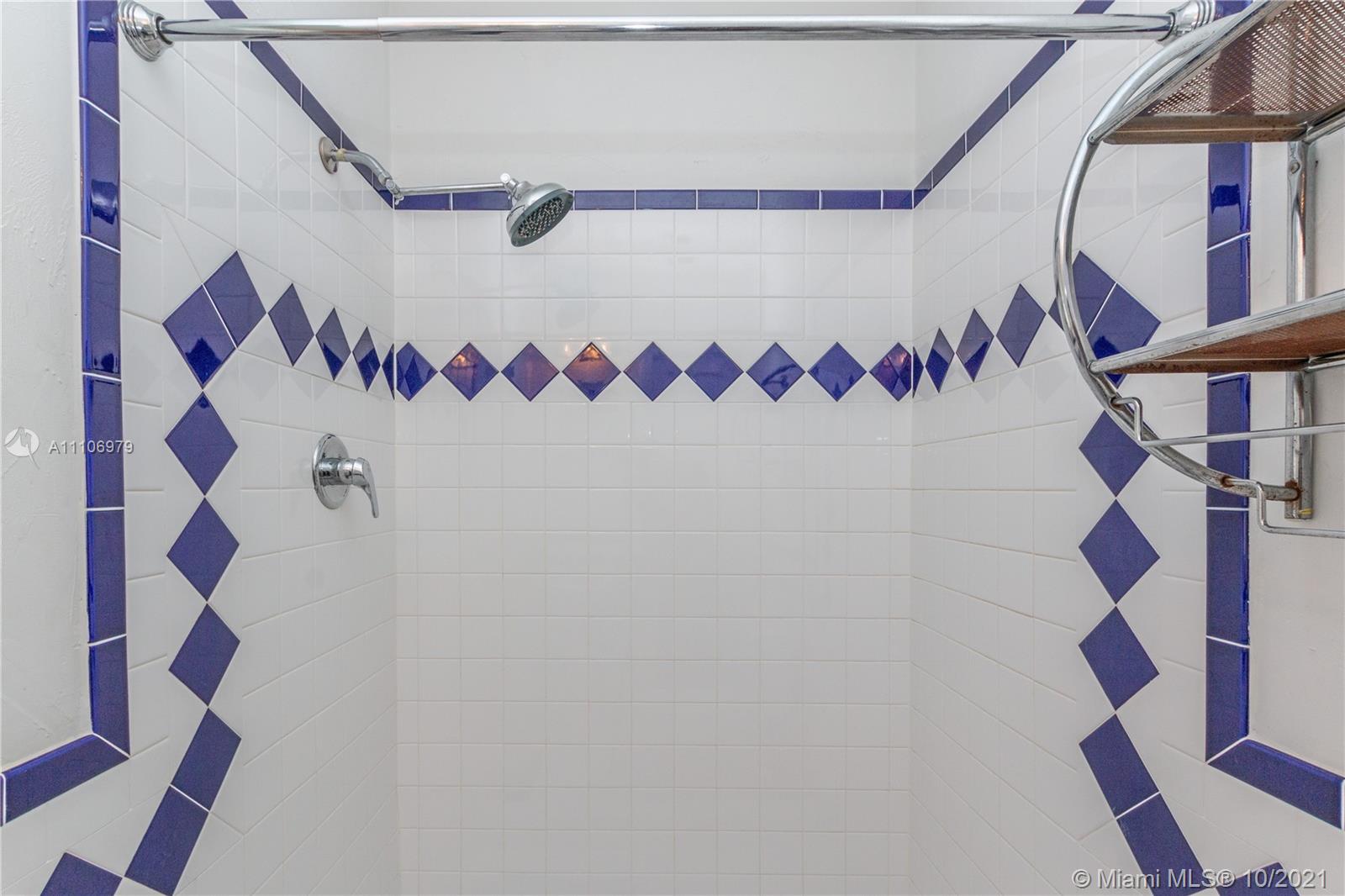 5173 Alton Road Miami Beach, FL 33140 - Photo 19 of 31 a bathroom with a sink and a shower