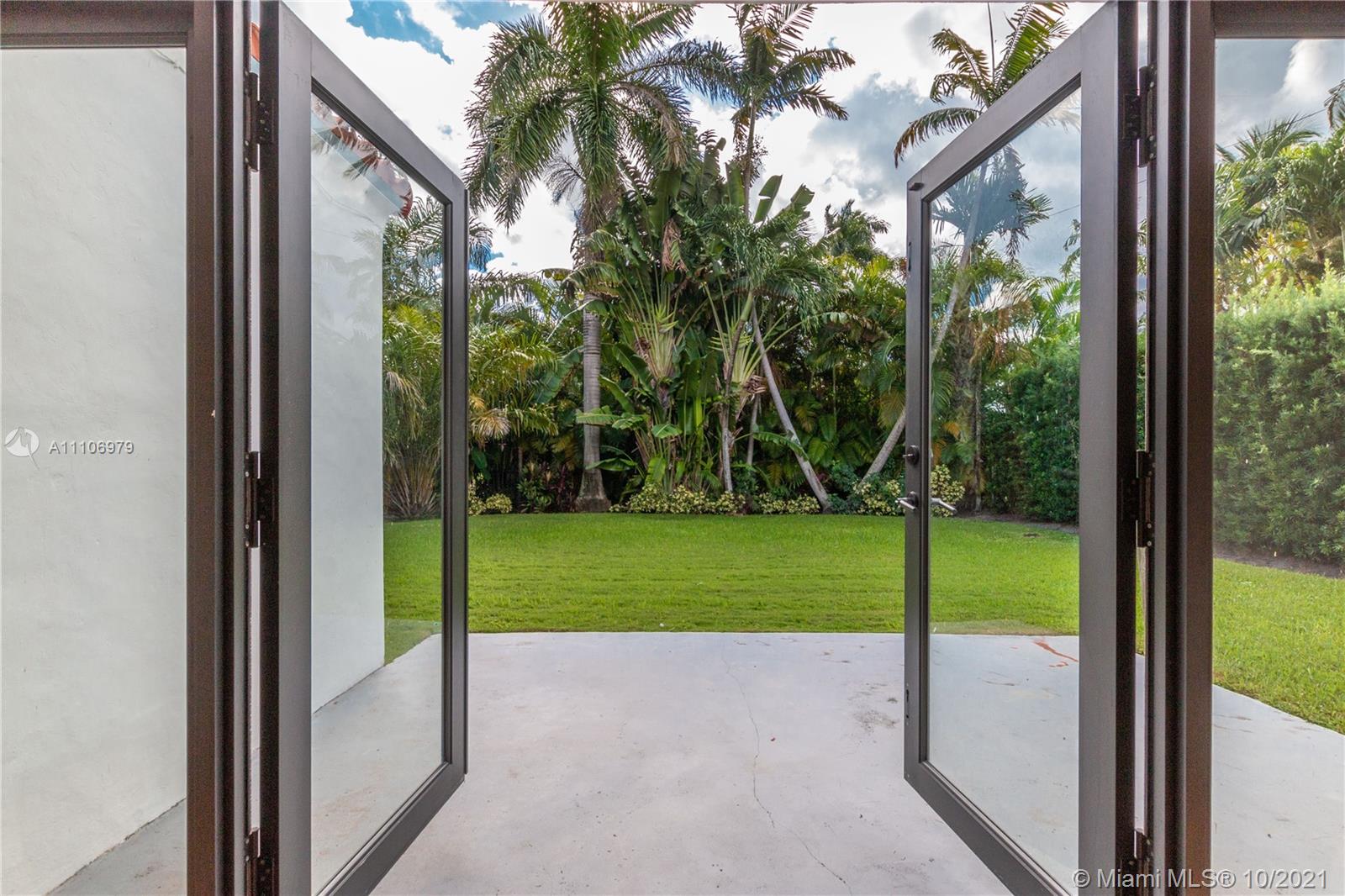 5173 Alton Road Miami Beach, FL 33140 - Photo 24 of 31 a view of back yard from a window