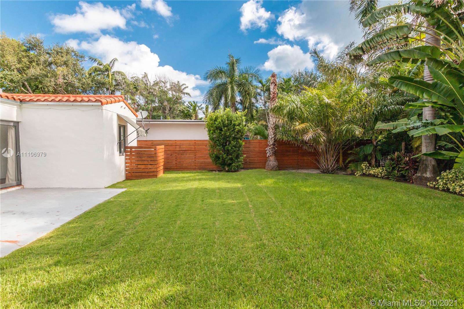 5173 Alton Road Miami Beach, FL 33140 - Photo 27 of 31 a front view of a house with a yard