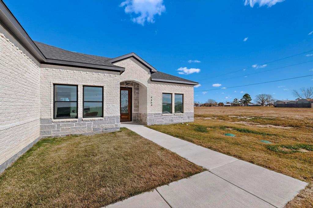 4464 Key Ranch Road Trinidad, TX 75163 - Photo 5 of 40 Property entrance featuring brick siding, a lawn, and a shingled roof