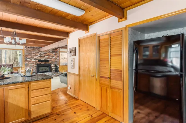 a kitchen with a refrigerator and a stove