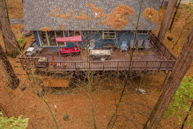 a view of a house with large trees