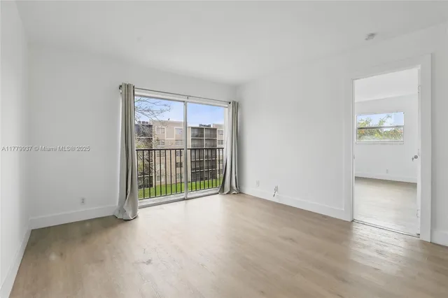a view of a room with a large window