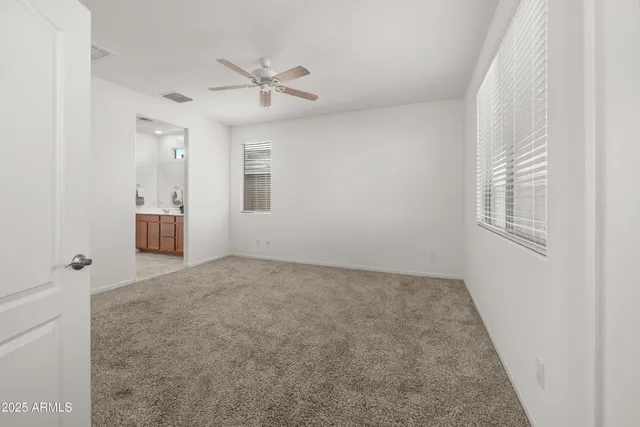 a view of an empty room and a window