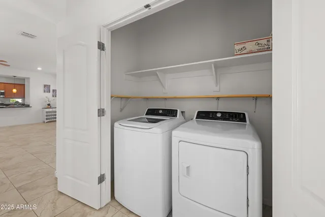 a utility room with dryer and washer