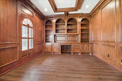 a view of front door with wooden floor