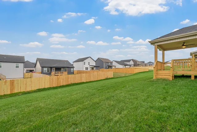 a view of a backyard of the house