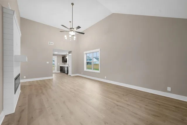 wooden floor in an empty room with a window