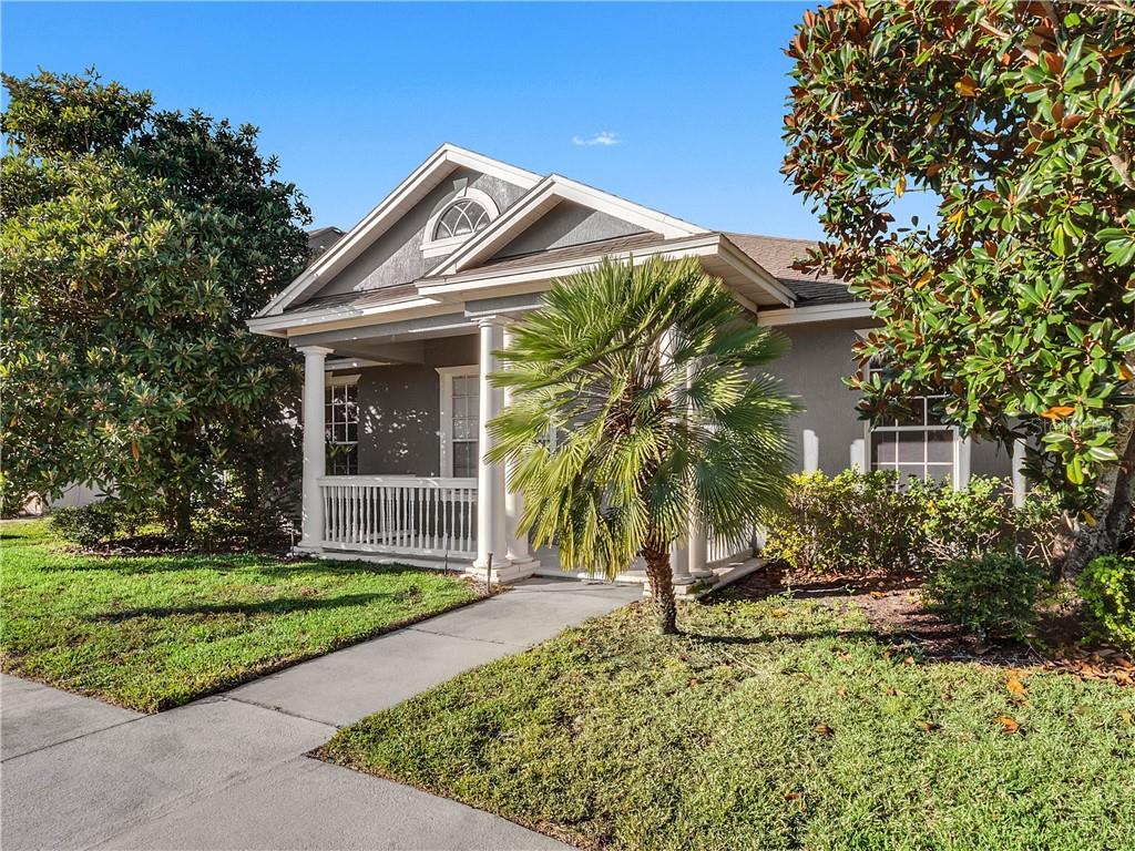 12945 Overstreet Road Windermere, FL 34786 - Photo 1 of 1 a front view of a house with a yard