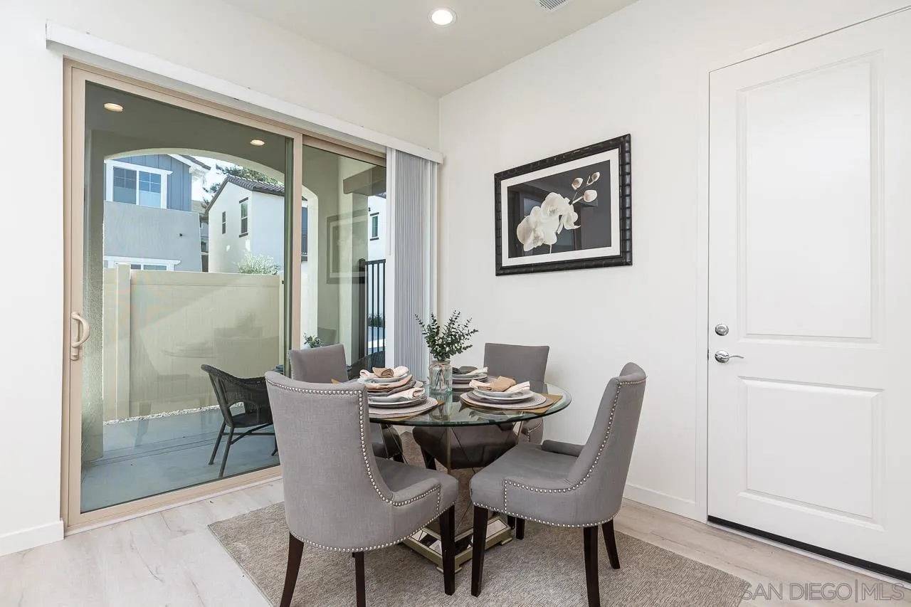 597 Townsend Way San Marcos, CA 92078 - Photo 12 of 30 a view of a dining room with furniture wooden floor and a carpet