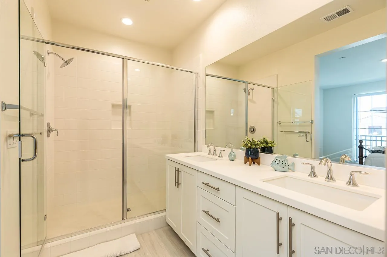 597 Townsend Way San Marcos, CA 92078 - Photo 19 of 30 a bathroom with a double vanity sink mirror and double