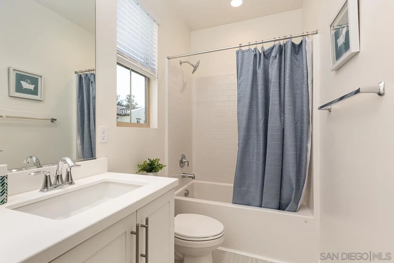 597 Townsend Way San Marcos, CA 92078 - Photo 22 of 30 a bathroom with a sink a toilet and shower