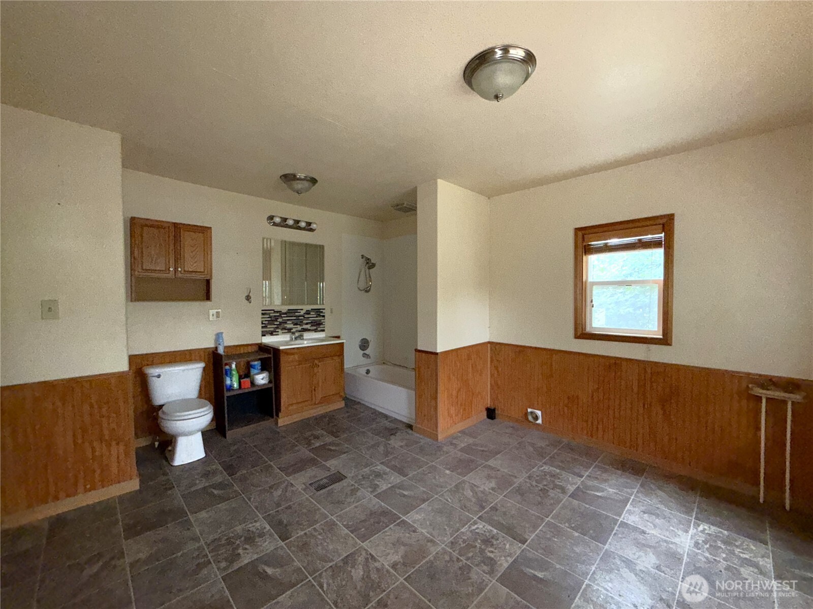 653 East 9th Street Republic, WA 99166 - Photo 16 of 23 a large bathroom with a large tub and sink