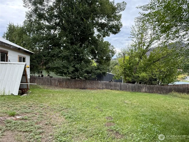 a view of a backyard with a small cabin