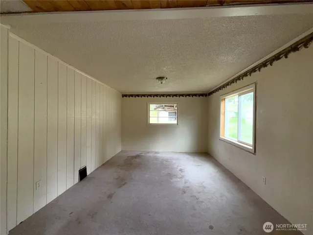 a view of empty room with windows