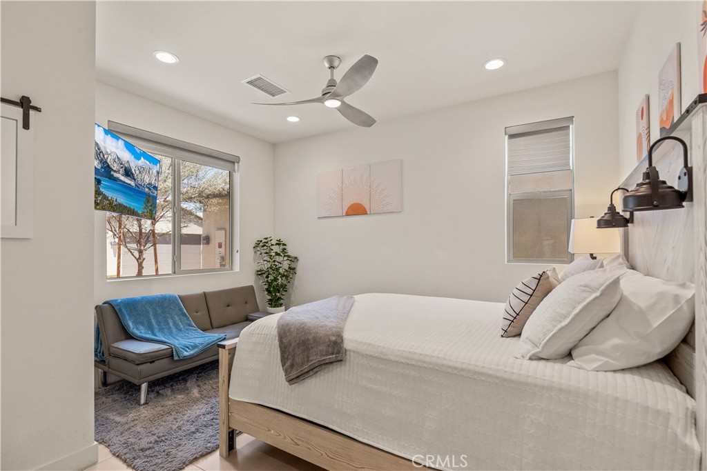 80281 Redstone Way La Quinta, CA 92253 - Photo 11 of 21 a bedroom with a bed and wooden floor