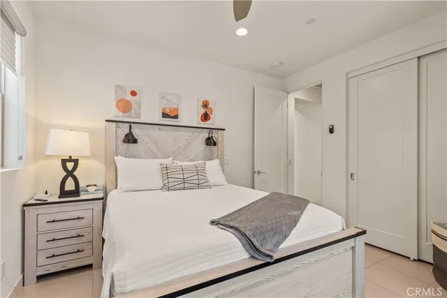 a bedroom with a bed and cabinets